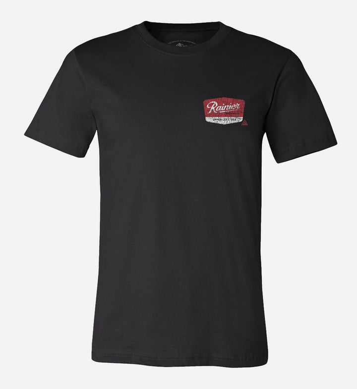 Back of a black t-shirt by The Great PNW featuring a distressed red and white vintage graphic that reads "Rainier Brewing Co." and "Upper Left, USA" with the text "Brewed for the Great Pacific Northwest" below it.