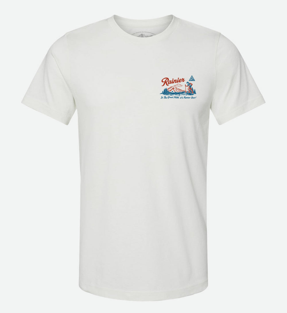 Back of a white t-shirt by The Great PNW featuring a retro red and blue graphic. The design includes an outline of Washington state, a Rainier Beer bottle and can, a deer, outdoor lifestyle scenes, Mt. Rainier, the word "Rainier" in script, and the text "In The Great PNW, it's Rainier Beer!".