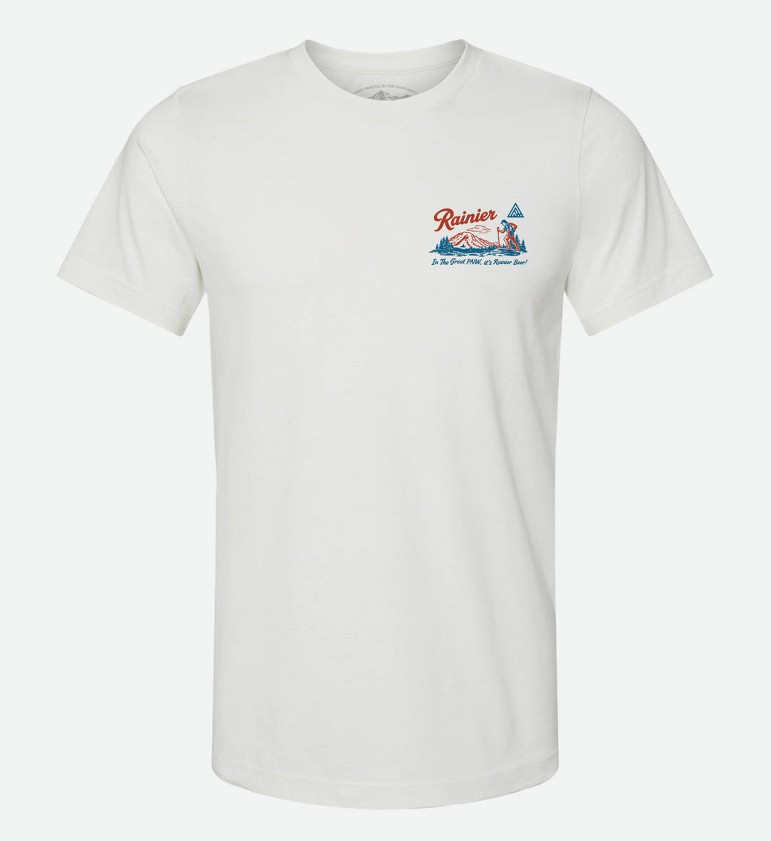 Back of a white t-shirt by The Great PNW featuring a retro red and blue graphic. The design includes an outline of Washington state, a Rainier Beer bottle and can, a deer, outdoor lifestyle scenes, Mt. Rainier, the word "Rainier" in script, and the text "In The Great PNW, it's Rainier Beer!".