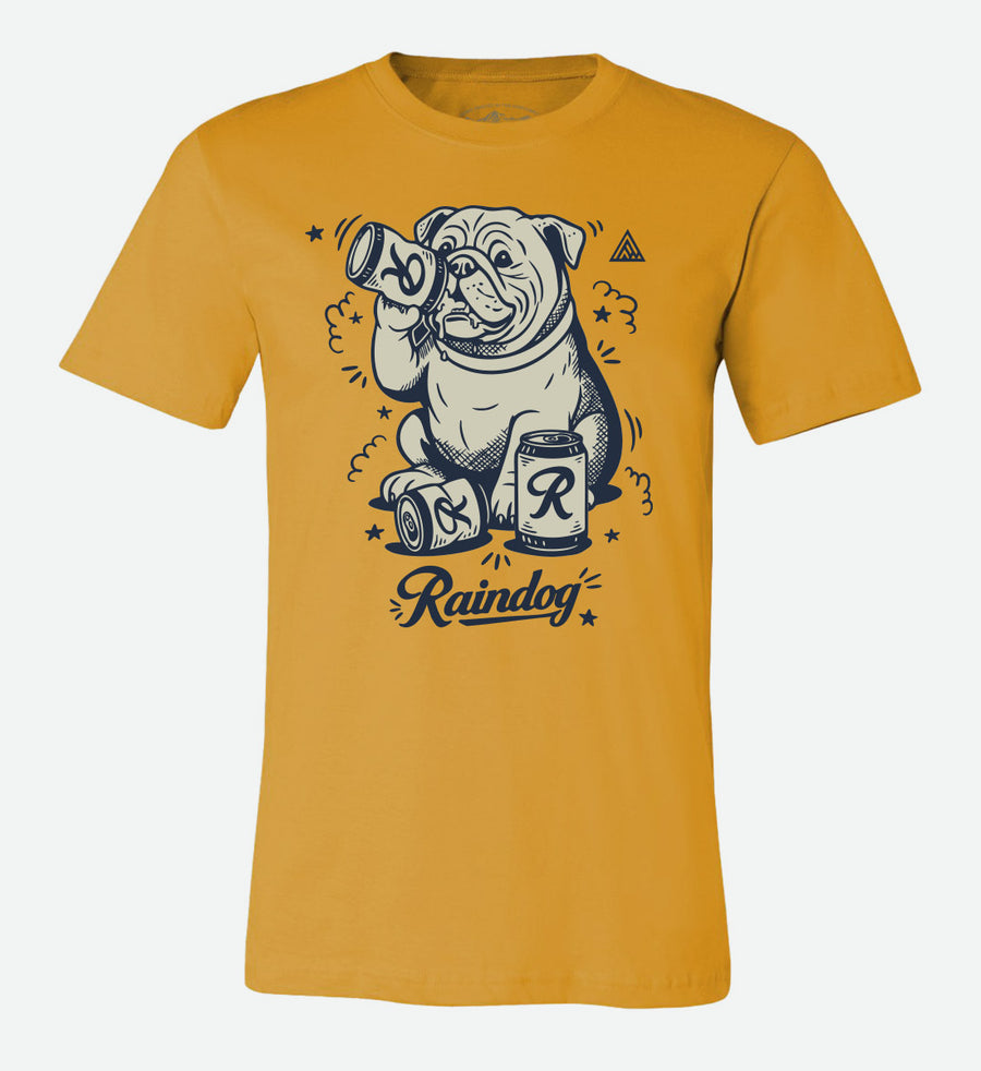 Mustard yellow t-shirt by The Great PNW featuring a graphic illustration of a bulldog drinking a can of Rainier Beer with the word "Raindog" written in cursive below.